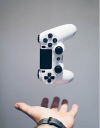 picture of a controller being tossed in the air